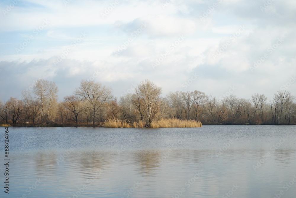 Sad autumn river landscape with cloudy sky Sad autumn river landscape with cloudy sky