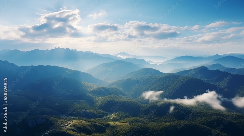 View from above of the stunning and vibrant landscape with awe-inspiring mountains in the background.