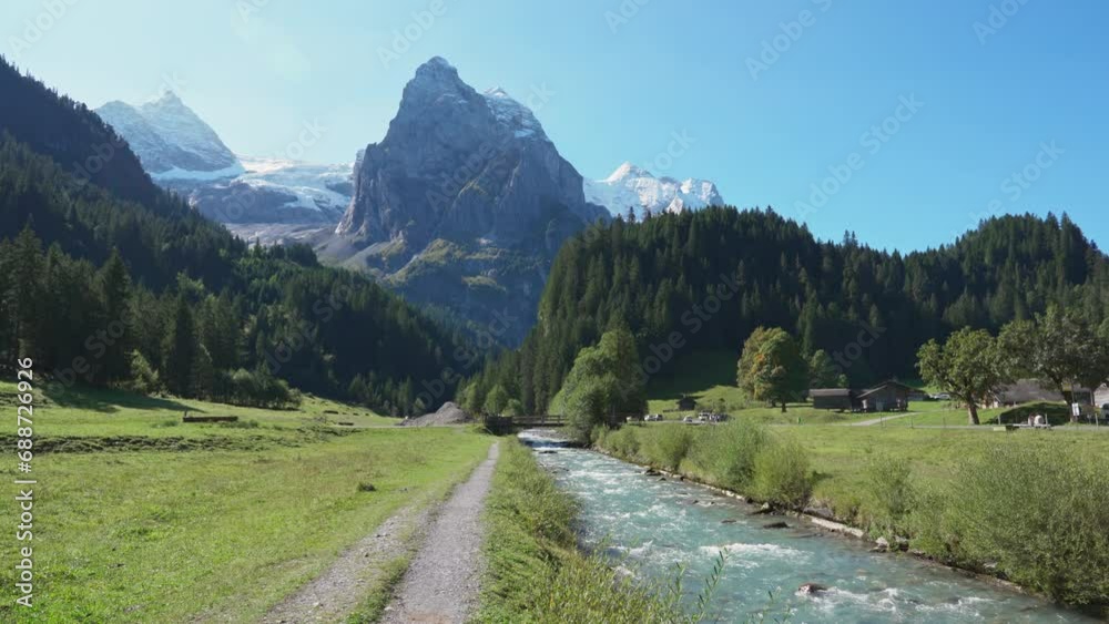 Swiss Alps view of Rosenlaui with Wellhorn and Reichenbach river in summer at Switzerland Swiss Alps view of Rosenlaui with Wellhorn and Reichenbach river in summer at Switzerland