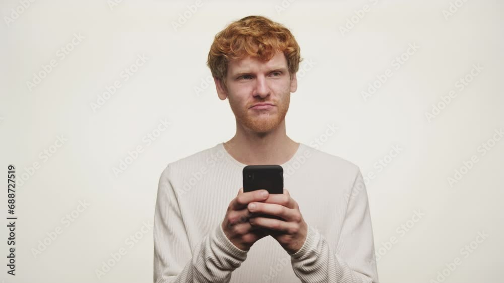 Ginger Guy Thinking Before Texting Back on White Background Ginger Guy Thinking Before Texting Back on White Background