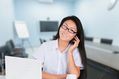 Young Female Working in office on Laptop Computer