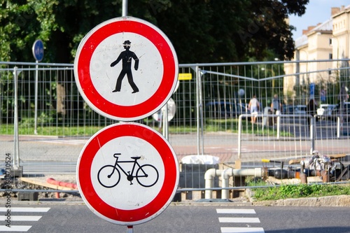 Two traffic signs forbidding trespassing for pedestrians and bicycles as the street is reconstructed photo