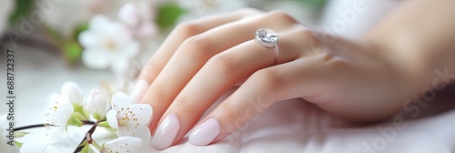 Beautiful well-groomed hands of the bride with modern manicure, nail design for the bride, banner photo