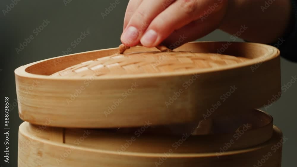 Japanese gyoza on wooden steamer close-up. Fried dumplings with meat. Steaming Technique. Cooking at cafe, restaurant. Homemade. Delivery