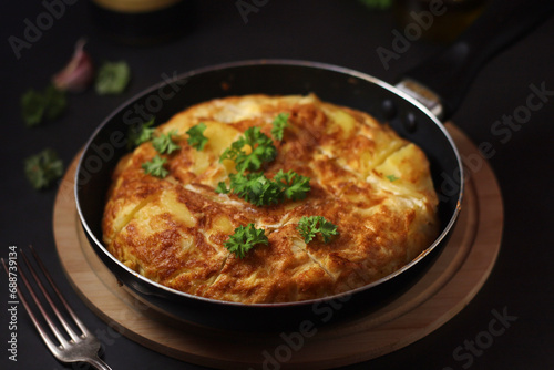 Traditional Spanish dish tortilla on the table photo