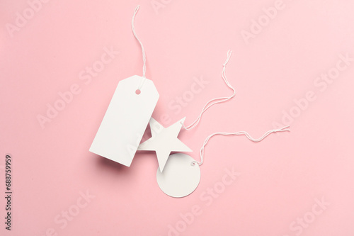 White blank different tags on string, pink background