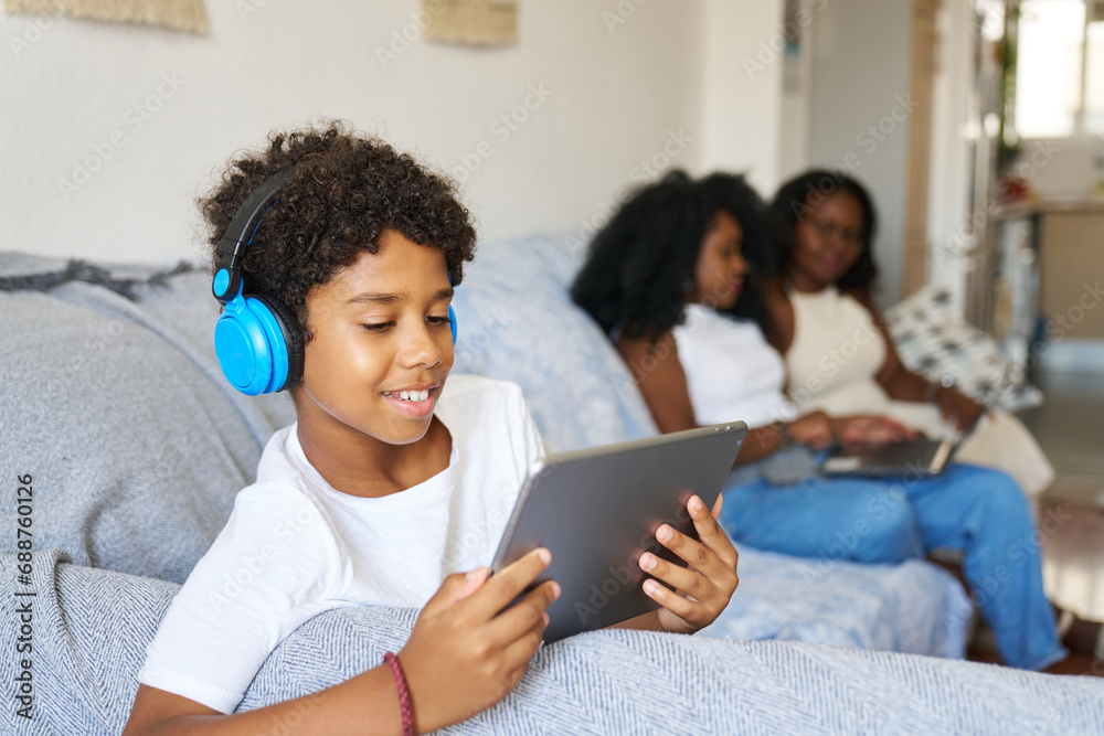 Boy with wireless gadgets at home Boy with wireless gadgets at home