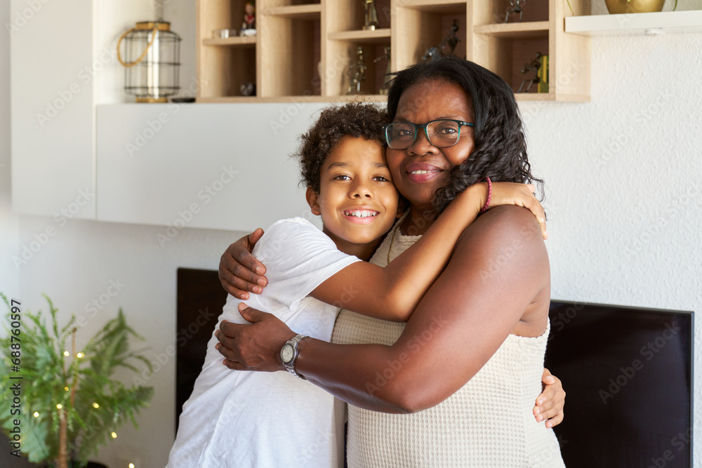 Mature woman embracing grandson Mature woman embracing grandson