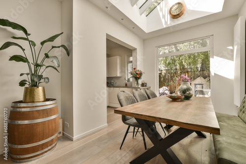 Dining room with wooden table and barrel decor photo