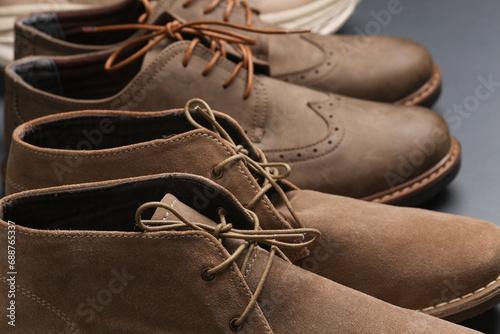 Close-up of men's casual boots on a dark gray background photo