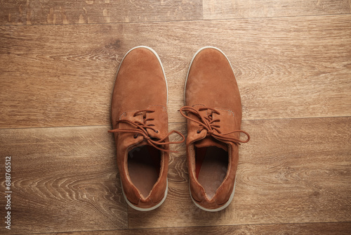 Men's suede shoes on the floor. Top view