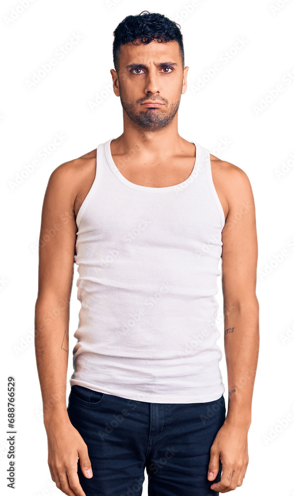 Fototapeta premium Young hispanic man wearing casual clothes depressed and worry for distress, crying angry and afraid. sad expression.