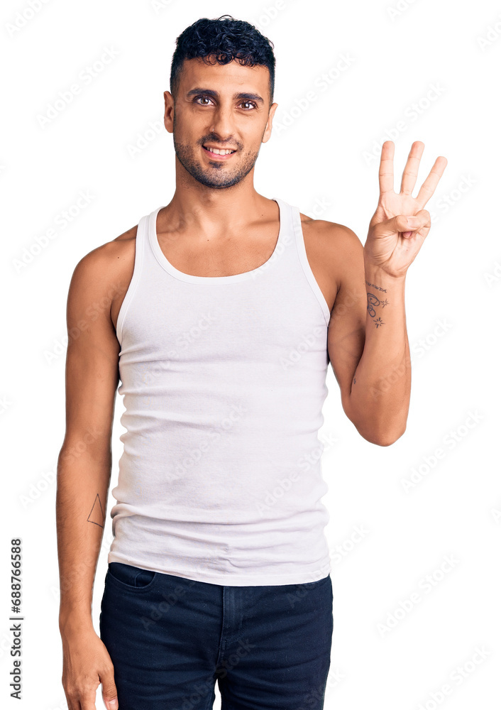 Young hispanic man wearing casual clothes showing and pointing up with fingers number three while smiling confident and happy. Young hispanic man wearing casual clothes showing and pointing up with fingers number three while smiling confident and happy.