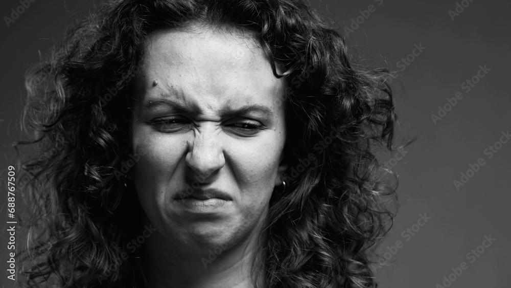 Female Expressing Extreme Aversion, Disgusted Reaction Portrait in black and white, monochromatic clip