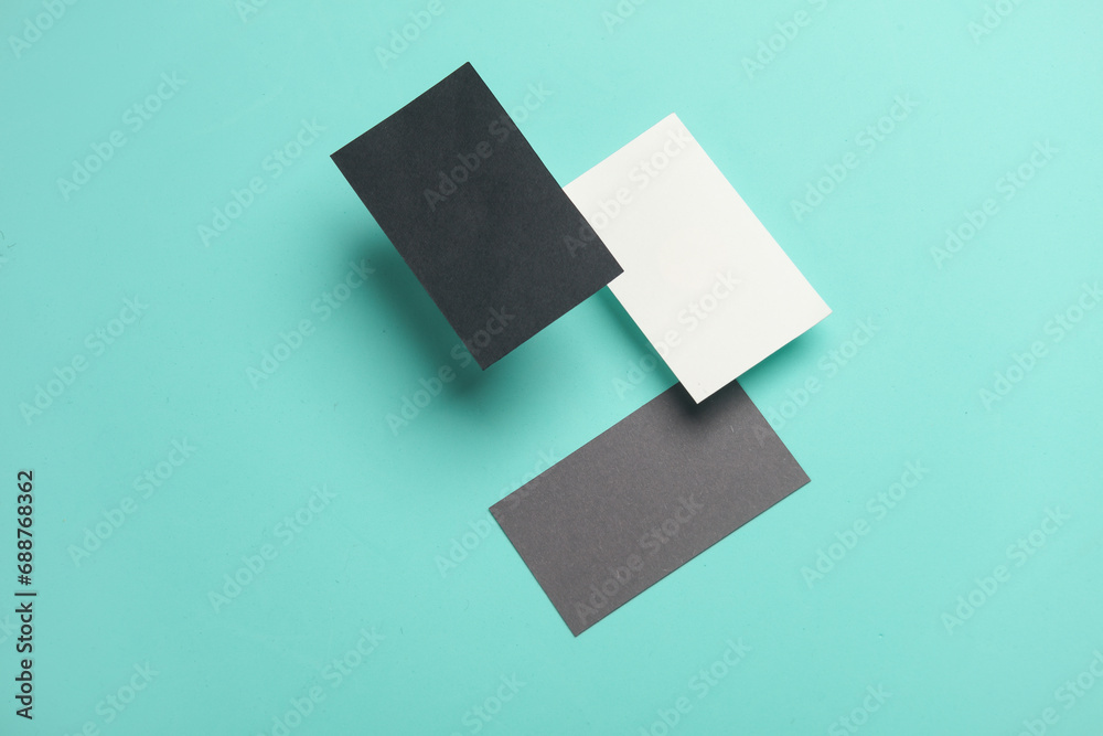 Composition of floating business cards on a blue background. Business concept Composition of floating business cards on a blue background. Business concept
