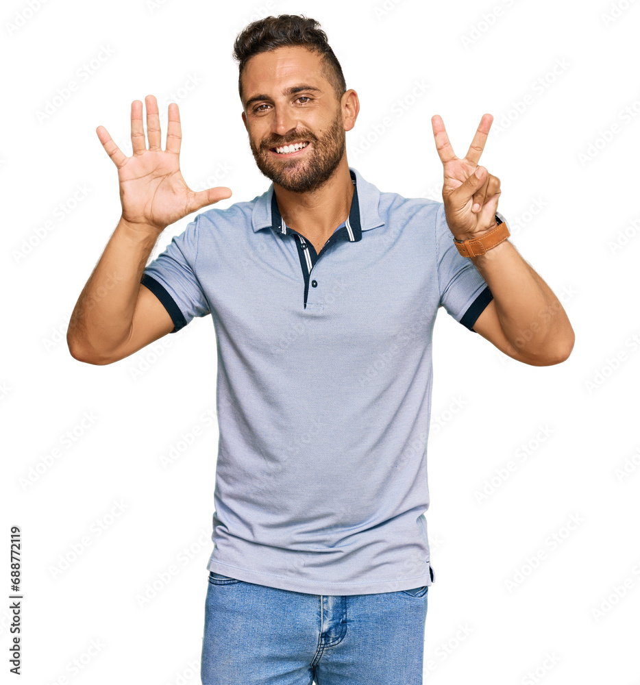 Fototapeta premium Handsome man with beard wearing casual clothes showing and pointing up with fingers number seven while smiling confident and happy.