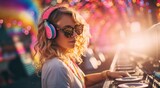 a woman in sunglasses is djing at a music festival,