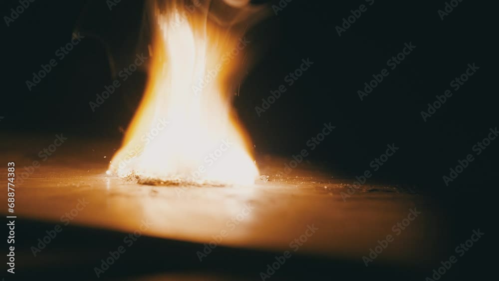 Light the flame. Metal shavings catch fire and burn. Trying to start a fire. Slow motion. High speed camera. 4K video Light the flame. Metal shavings catch fire and burn. Trying to start a fire. Slow motion. High speed camera. 4K video