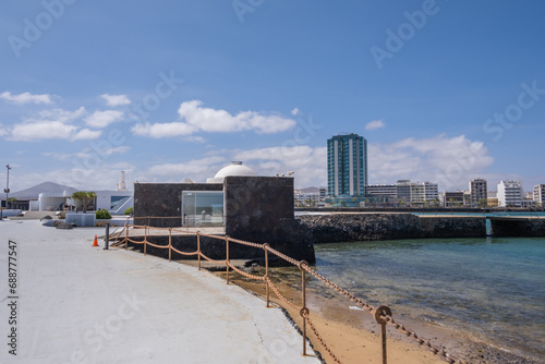Seascape. View of the city of Arrecife from the Fermina islet. White sand beach and jetty. Lanzarote, Canary Islands, Spain. © Jess