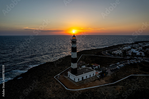 Sunset at Faro d'Artrutx Lighthouse in Menorca photo
