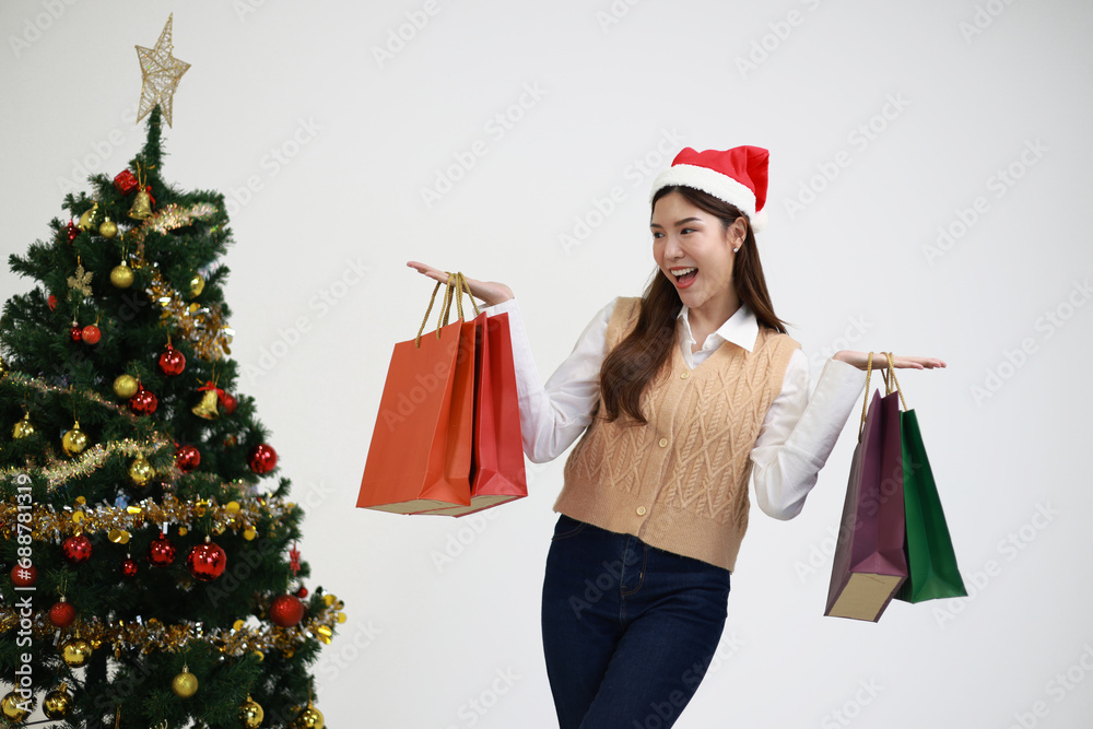 Portrait cute woman with shopping on Christmas day Portrait cute woman with shopping on Christmas day