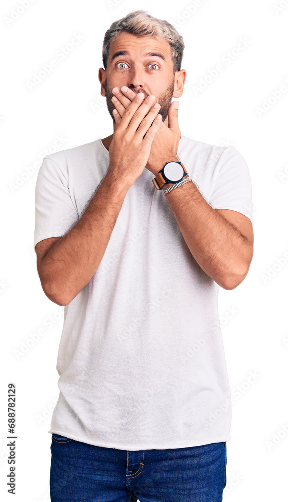 Young handsome blond man wearing casual t-shirt looking away to side with smile on face, natural expression. laughing confident. Young handsome blond man wearing casual t-shirt looking away to side with smile on face, natural expression. laughing confident.