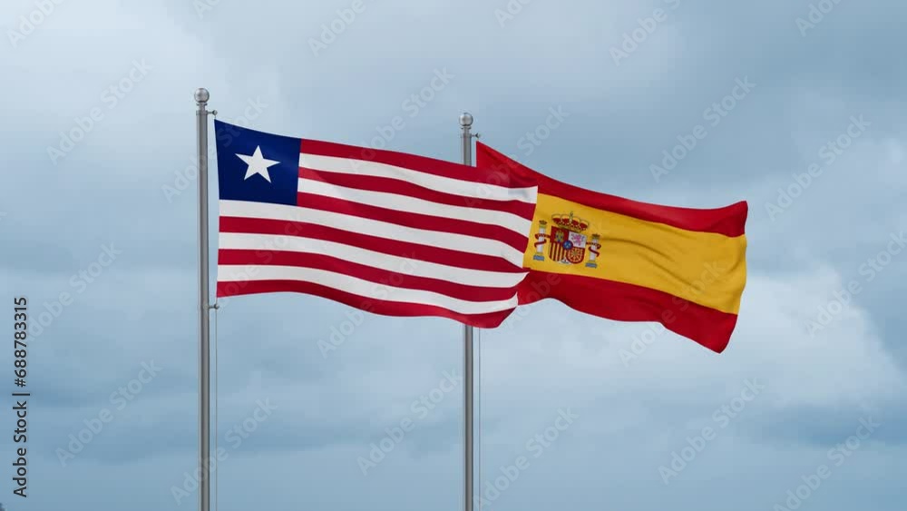 Spain and Liberia flag waving together on cloudy sky, endless seamless loop, two country cooperation concept Spain and Liberia flag waving together on cloudy sky, endless seamless loop, two country cooperation concept