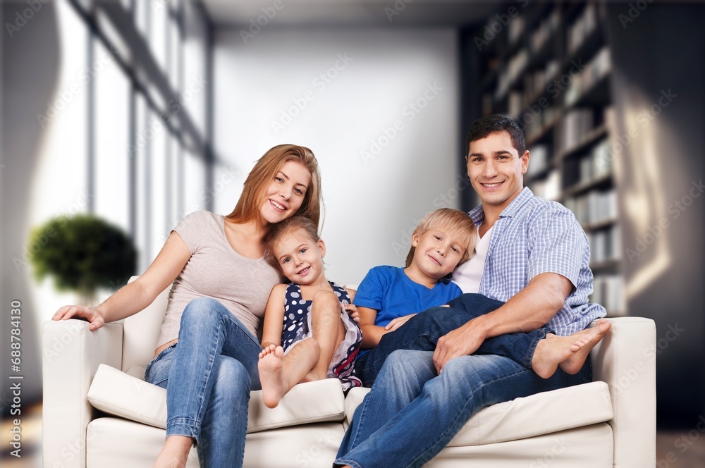 Happy young parents and kids resting at home Happy young parents and kids resting at home
