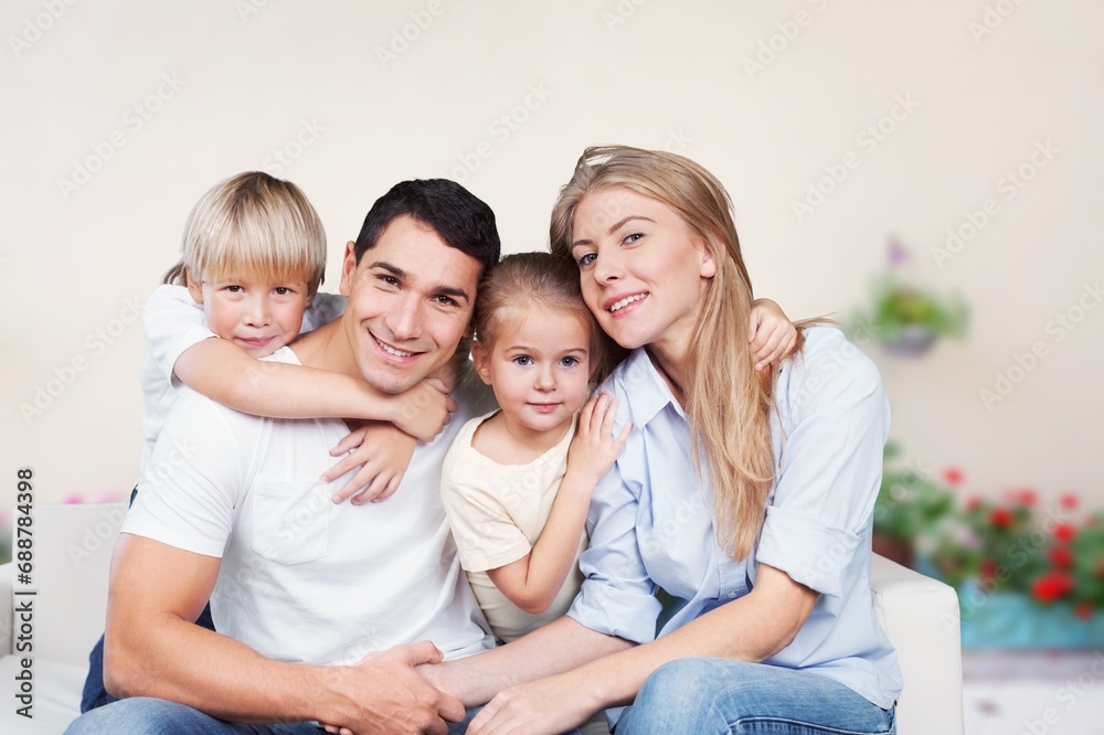 Happy young parents and kids resting at home Happy young parents and kids resting at home