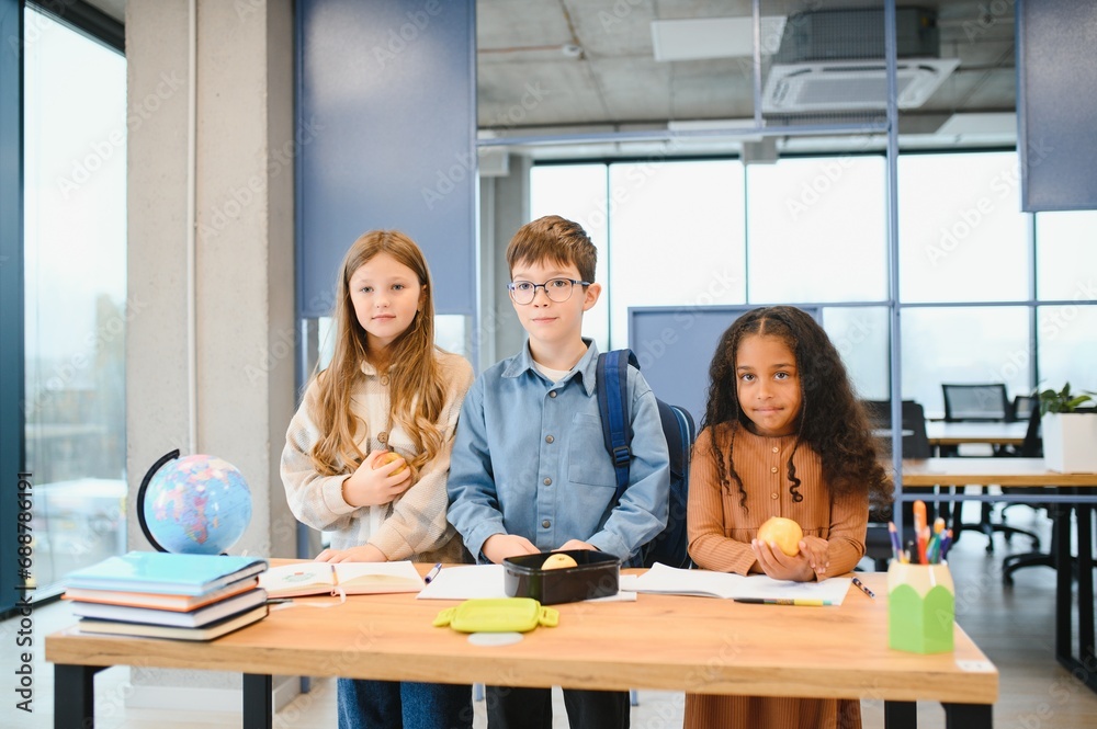 custom made wallpaper toronto digitalMultiracial schoolchildren having lunch at the desk during a break in school