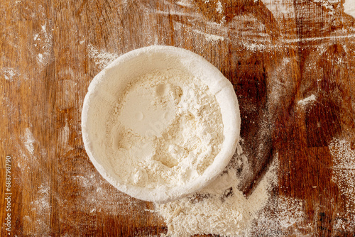 Closeup of flour in bowl at bakery photo