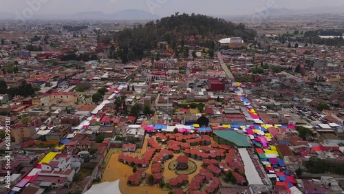 Proyecto sin títuloAerial video of the Municipality of Metepec at sunset making a dolly-in camera movement towards the Cerro de los Magueyes with the Nevado de Toluca in the back. photo