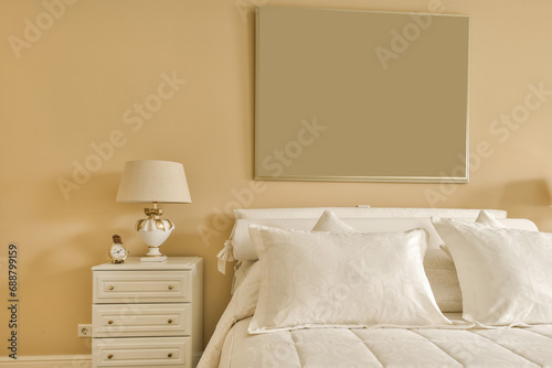 Bedroom with bed and frame on wall photo