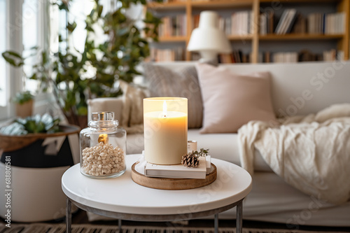 burning candles on the table in Scandinavian style. hygge atmosphere with cozy composition. © Juli Puli
