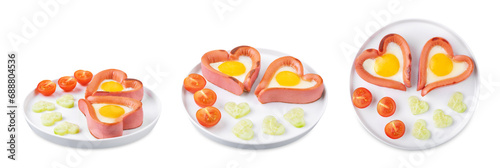 Fresh breakfast with fried sausage with fried egg in the form of heart for Valentine's day holiday on a white isolated background
