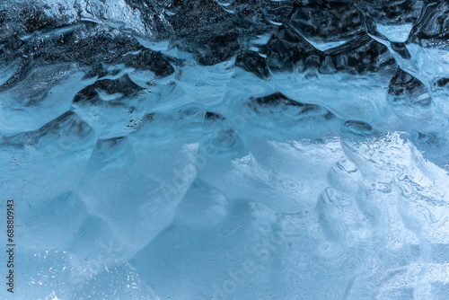 Intricate patterns of blue ice texture photo