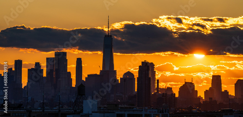 Sunset over the city silhouette on Manhattan New York 