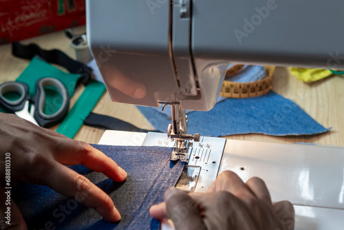 Sewing fabric with a modern machine photo