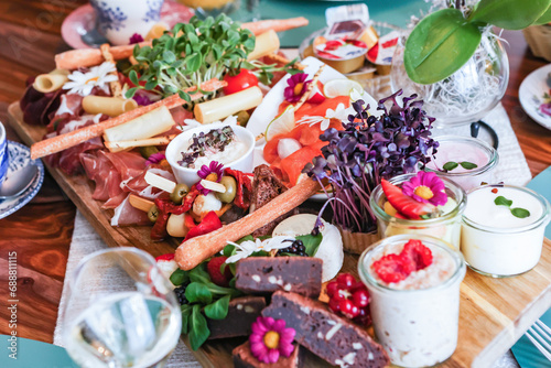 Gourmet charcuterie board with assorted snacks photo