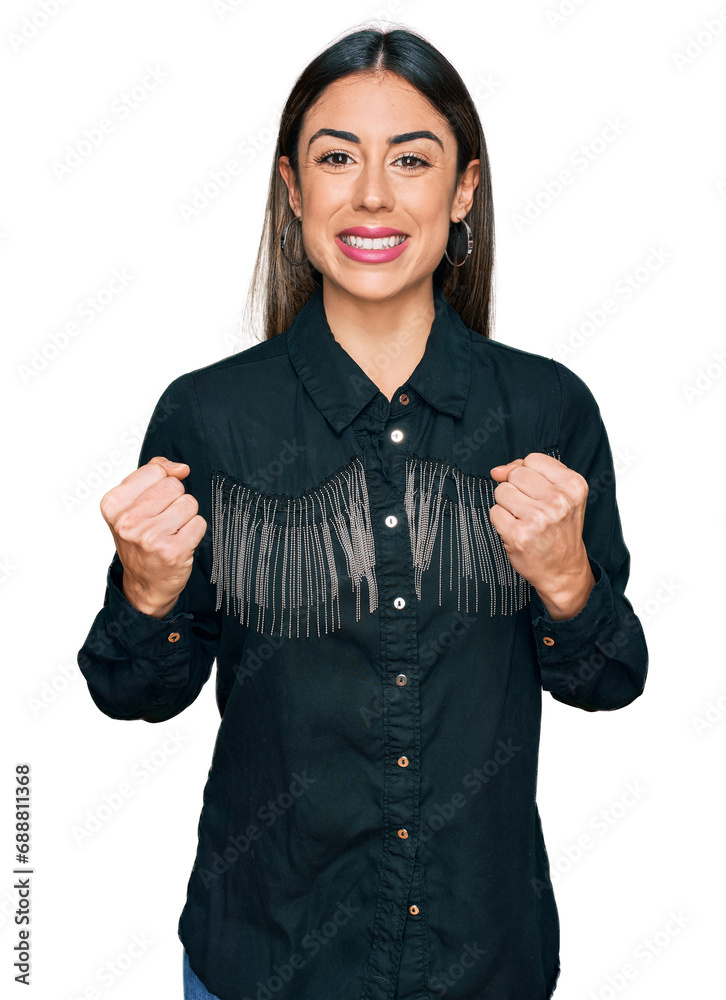 Young hispanic woman wearing casual clothes excited for success with arms raised and eyes closed celebrating victory smiling. winner concept. Young hispanic woman wearing casual clothes excited for success with arms raised and eyes closed celebrating victory smiling. winner concept.