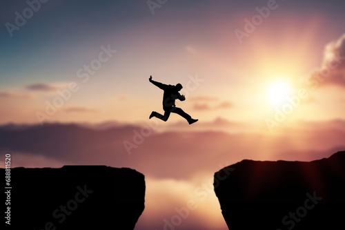 Man jumping on dark cliff with 2024 numbers