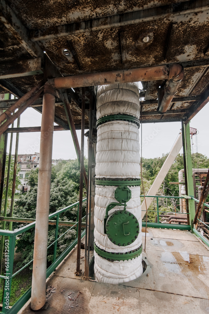 Large pipeline with a closed hatch, with high gas pressure insulated in industry. Photography, chemical production. Large pipeline with a closed hatch, with high gas pressure insulated in industry. Photography, chemical production.