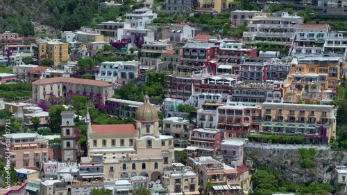 Wallpaper Mural Positano, tourist destination on the Amalfi Coast, Italy. Aerial view of Colorful houses on a Tyrrhenian sea coast seen through green juicy flora in Positano is a village in Naples metropolitan area Torontodigital.ca