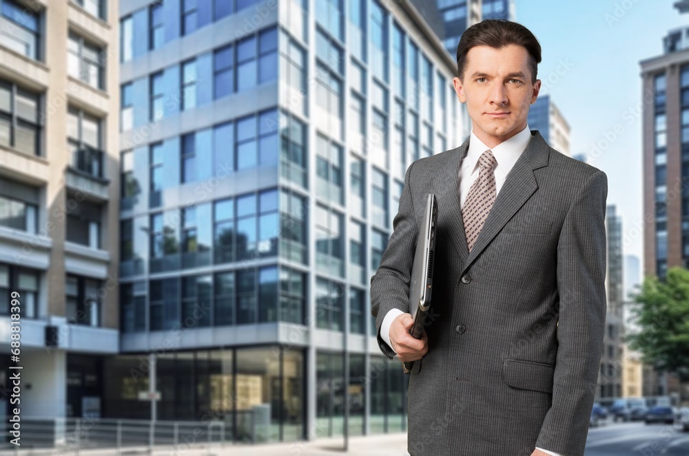 Portrait of young businessman posing on the street Portrait of young businessman posing on the street
