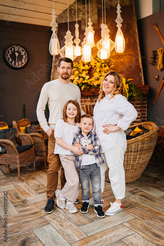 Happy family with two children in their home.  © andrey