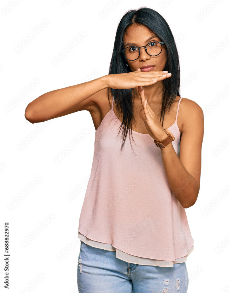 Young african american woman wearing casual clothes and glasses doing time out gesture with hands, frustrated and serious face Young african american woman wearing casual clothes and glasses doing time out gesture with hands, frustrated and serious face
