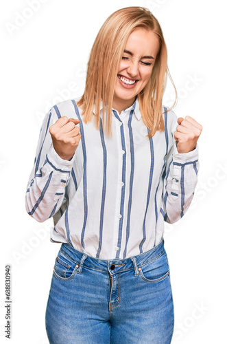 Beautiful caucasian woman wearing casual clothes very happy and excited doing winner gesture with arms raised, smiling and screaming for success. celebration concept.