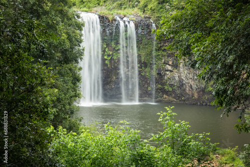 A waterfall called Dorrigo Falls framed by greenery in Dorrigo on the Waterfall Way in New South Wales, Australia.