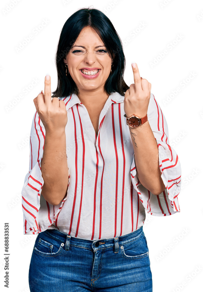 Young hispanic girl wearing casual clothes showing middle finger doing fuck you bad expression, provocation and rude attitude. screaming excited Young hispanic girl wearing casual clothes showing middle finger doing fuck you bad expression, provocation and rude attitude. screaming excited