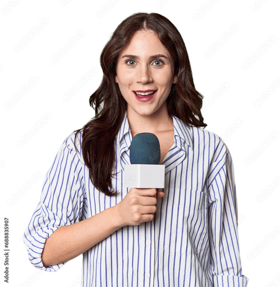Young Caucasian journalist with microphone in studio setting Young Caucasian journalist with microphone in studio setting